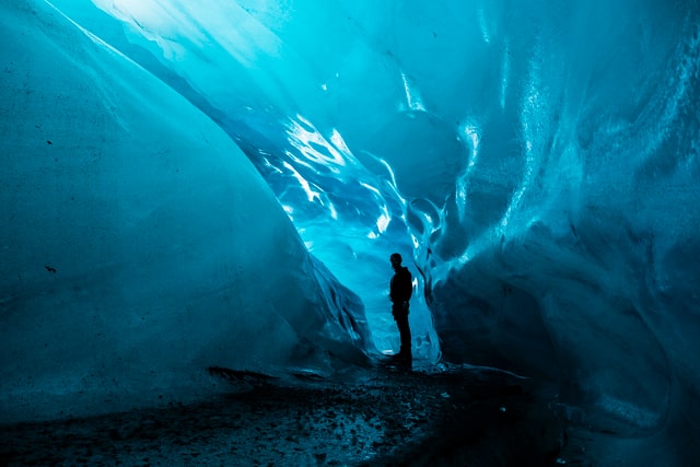 Hiker in Ice Cave